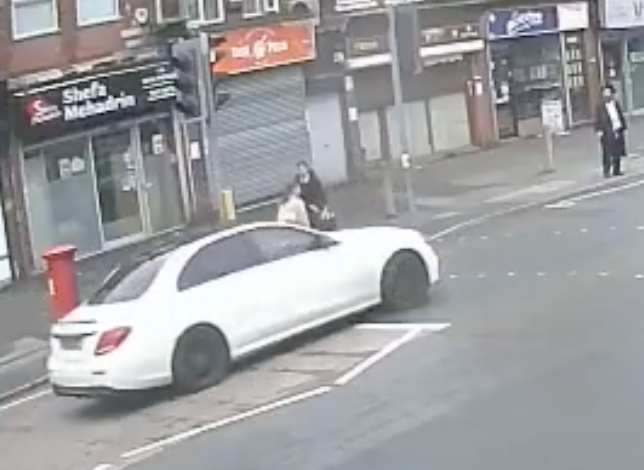 Car Accelerates Towards Family at Crossing in Hate Crime Investigation