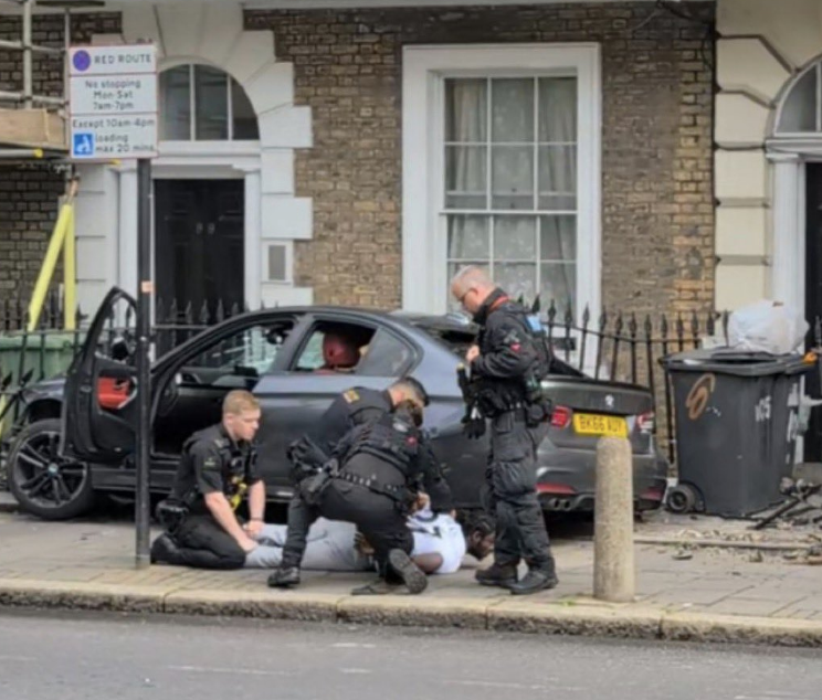Man Arrested Following Police Pursuit Ending in Overturned Police Car