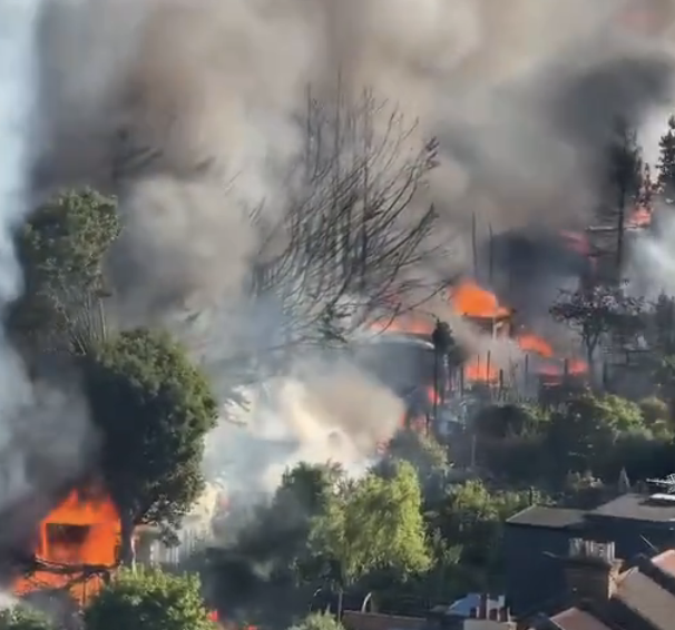 Major Walthamstow fire brought under control after 125 firefighters battle railway embankment blaze